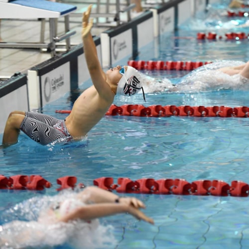 Swimmers entering pool