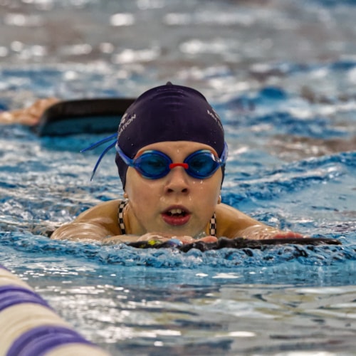 swimmers about to jump in pool