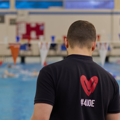 Swimmer in pool doing the backstroke